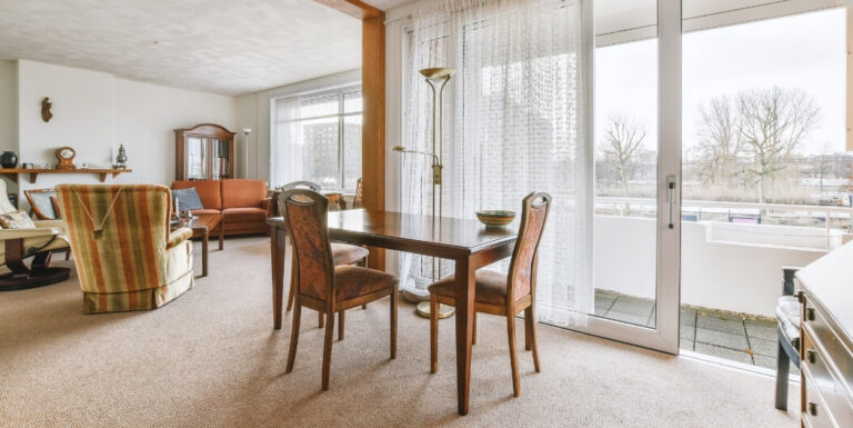 Spacious Apartment Living Room with Dining Area at Assisted Living Facility