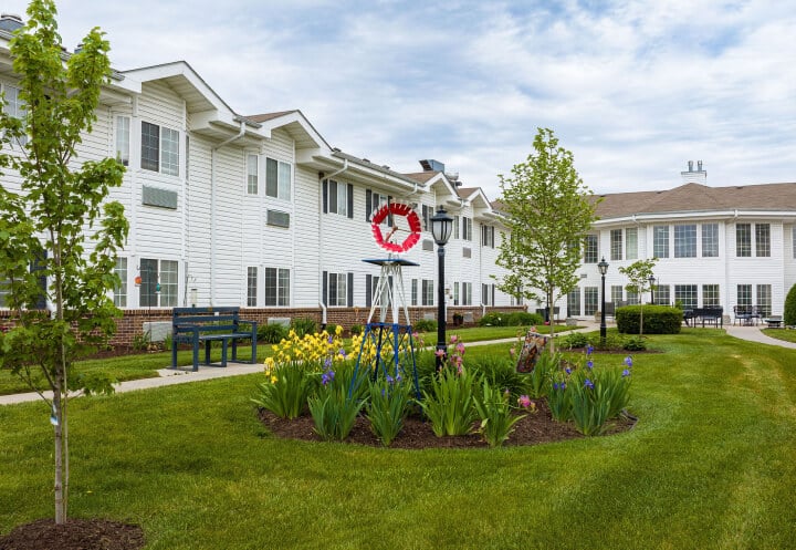 Flower Garden with Decorative Windmill and Bench at Assisted Living Facility Flower Garden with Decorative Windmill and Bench at Assisted Living Facility