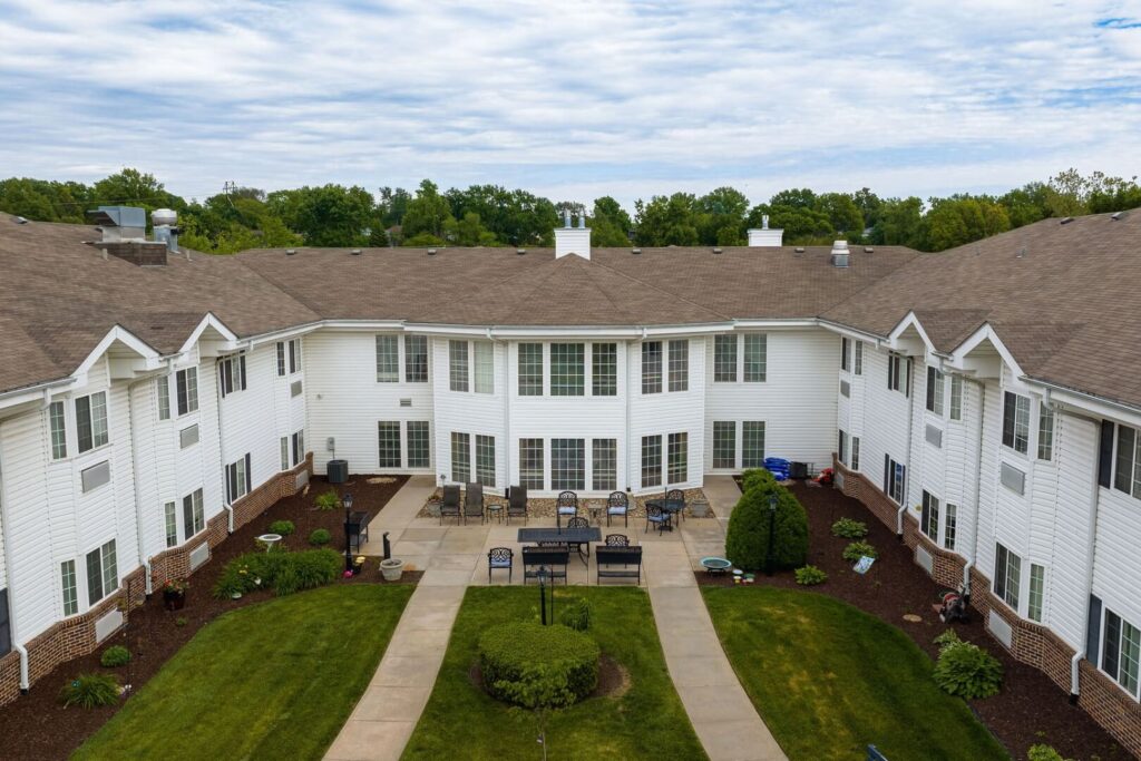Aerial View of U-Shaped Courtyard with Patio Seating at Assisted Living Community