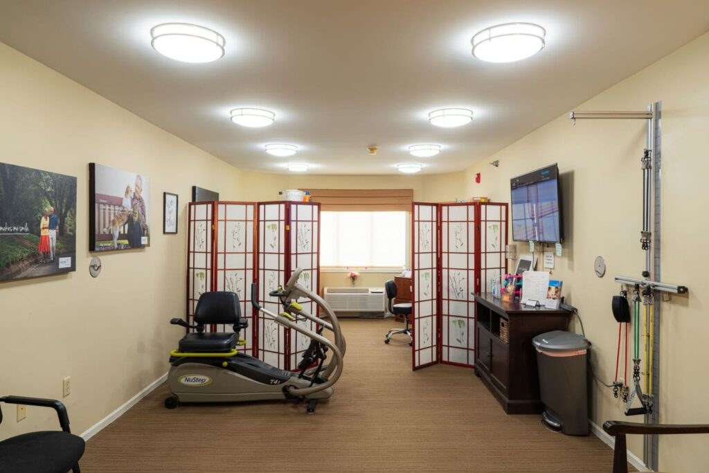 Therapy Room with Exercise Equipment and Rehabilitation Tools at Assisted Living Facility