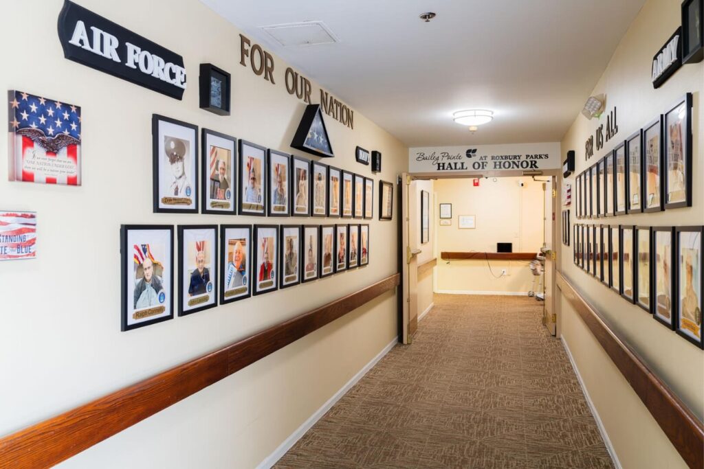 Veteran Tribute Hallway with Military Branch Displays at Assisted Living Facility