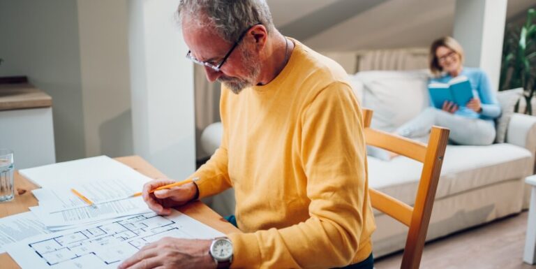Man Reviewing Floor Plans for Assisted Living Facility