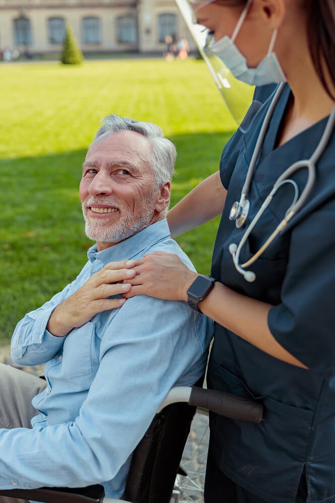 Nurse Comforting Elderly Woman at Nursing Home Colleyville